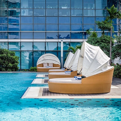 Hanoi hotel sunbeds by the swimming pool