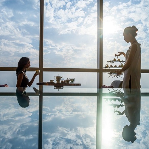 two girls enjoying afternoon tea at hanoi luxury hotel